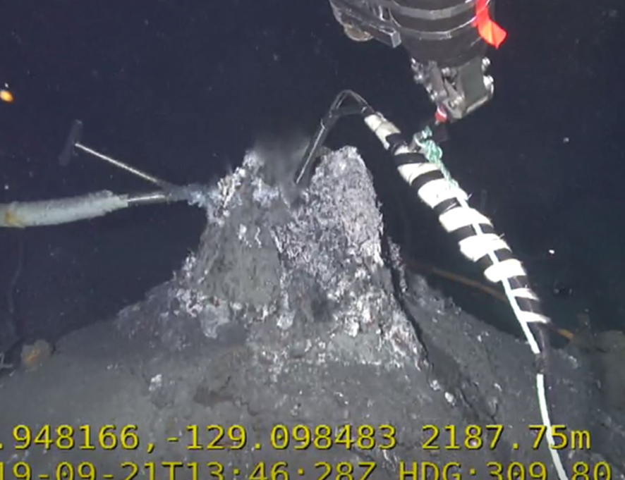 Snorkel of remotely operated hydrothermal vent fluid sampler being positioned 