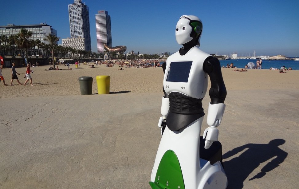 Upright humanoid robot on beach