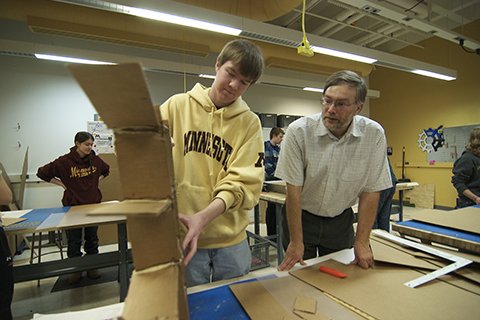 Frank Kelso with students building sleds.