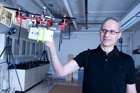 Stergios Roumeliotis holding a drone