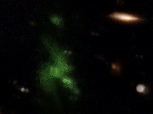 Lyman-alpha blob known as LAB-1 (greenish structure) shines with light powered by galaxies inside its envelope