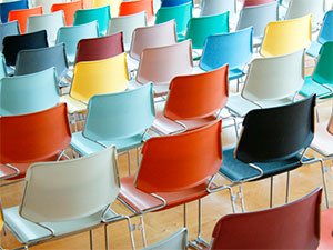 Multicolored chairs lined up in rows