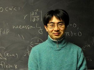 Yoichiro Mori in front of blackboard