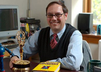Professor James Kakalios posing with his emmy