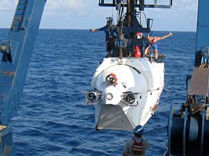 people on board the Alvin submersible as suspended above the ocean