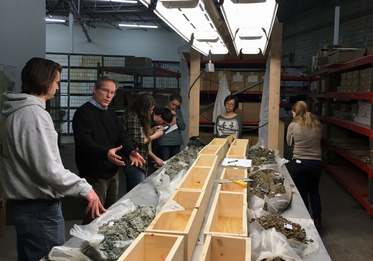 Geology class examining Quaternary glacial core with the help of MGS geologist, Gary Meyer.