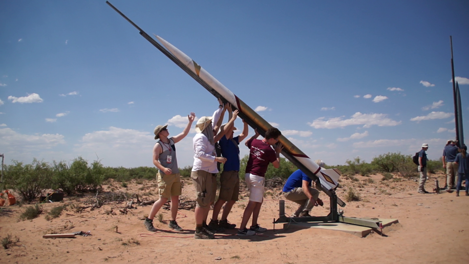 Rocket team lifting their rocket