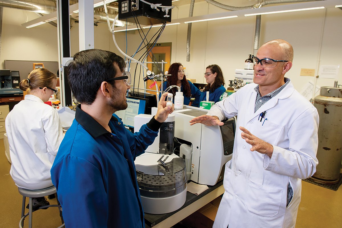 Five people in a research lab.