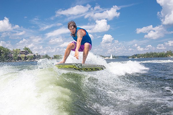 Man surfing a wake from a boat