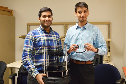 BizPitch student winners with robot and headband