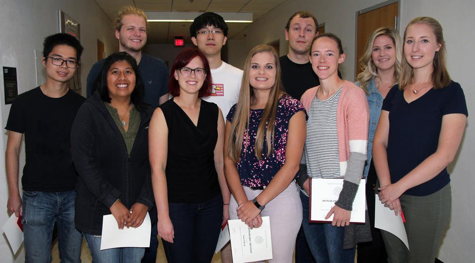 Teaching assistants who received honorable mentions in 2018-19 are, front row from left, Yukun Cheng, Maetzin Cruz-Reyes, Claire Seitzinger, Tana O'Keefe, Cecilia Douma, and Margaret Clapham. Back row from left, Nathan Love, Jiaqian Li, Aaron Schulzetenberg, and Katherine Jones. Not pictured: Shelby Auger, Taysir Bader, Celina Harris, and Connor Reilly.