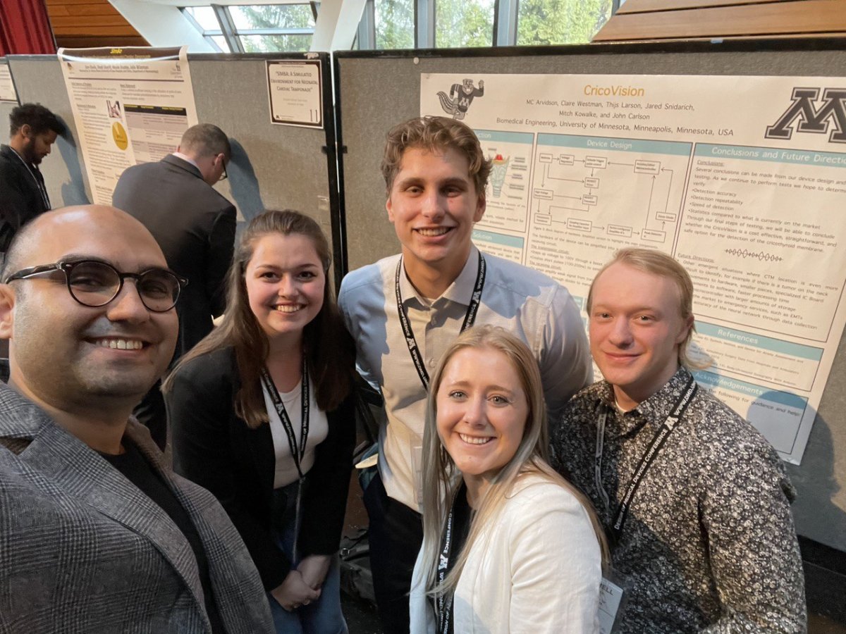 students with their research poster and mentor