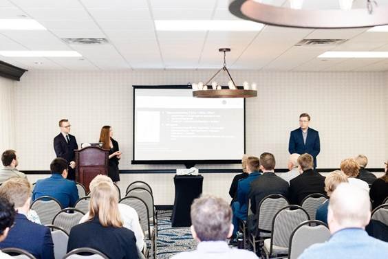 AEM students presenting at a conference
