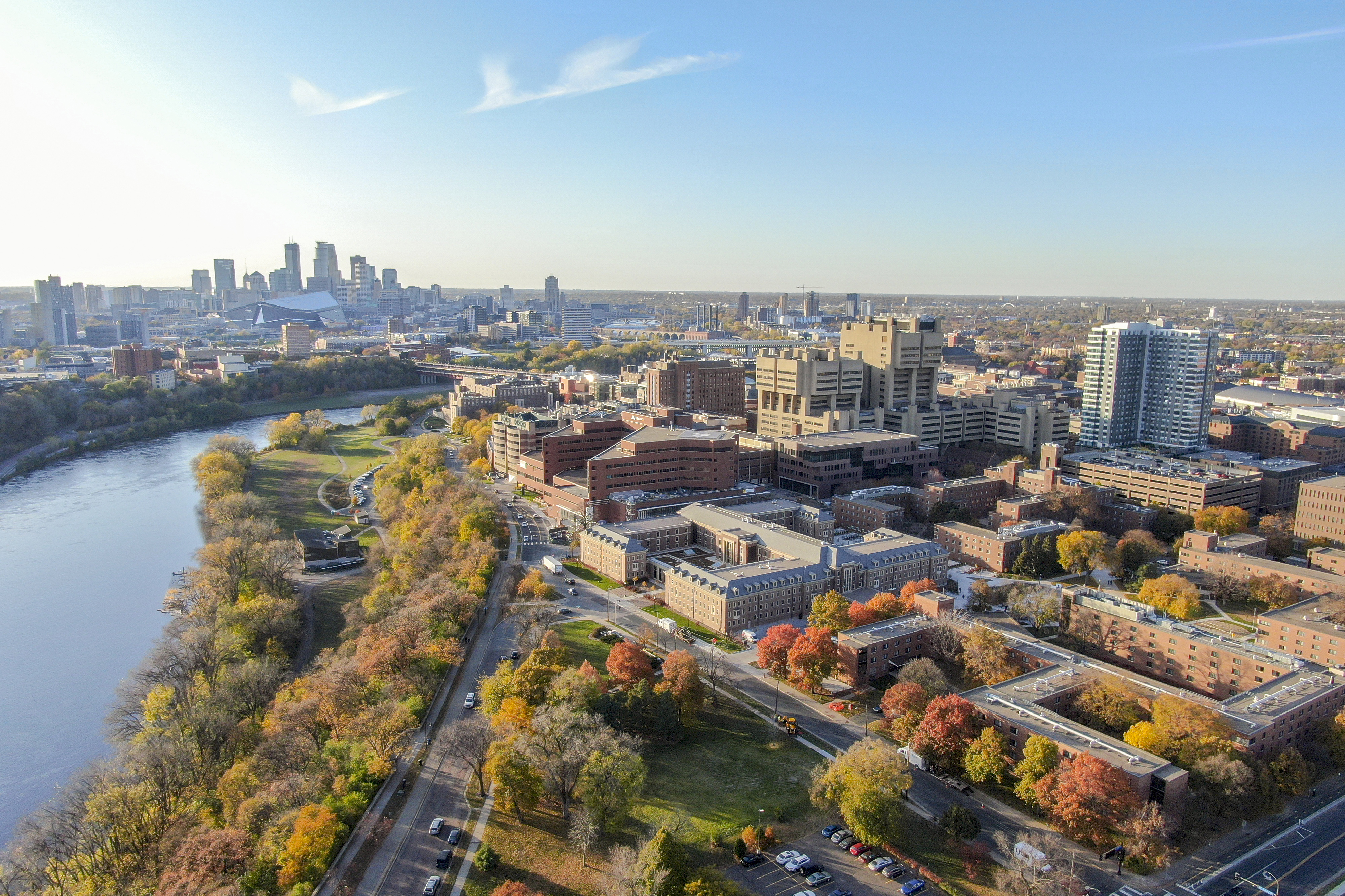Birds-eye view of the UMN Twin Cities campus, with the Minneapolis skyline.