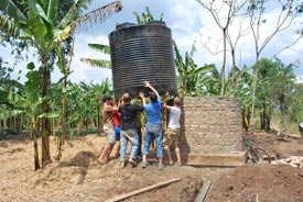 CEGE grad students assembling a water tank