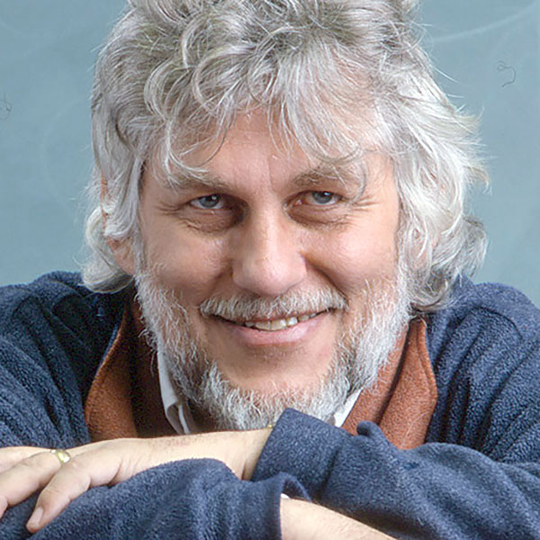 headshot of person with grey hair and beard